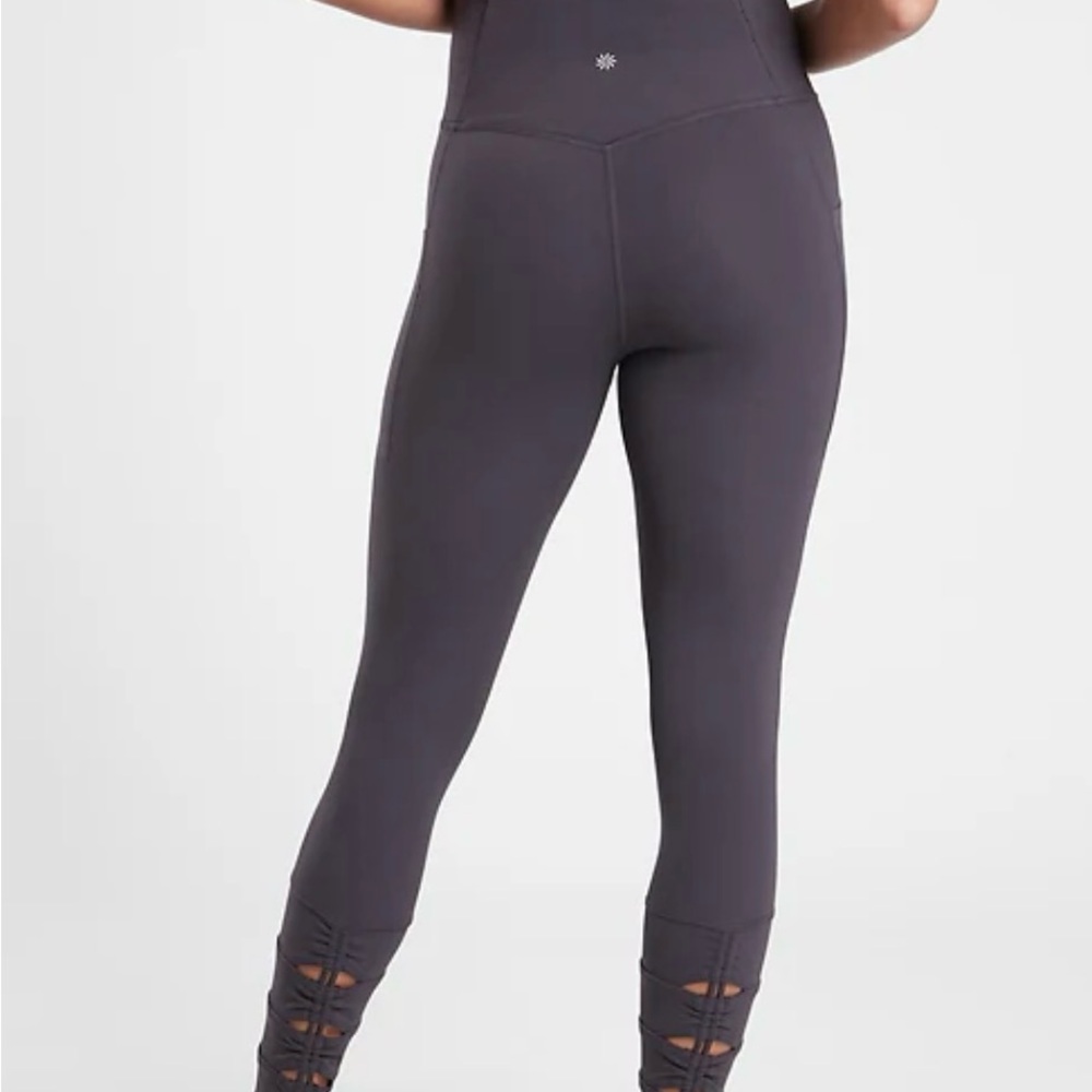Athleta Salutation high rise leggings.  Black.  Signs of wear on inner legs.